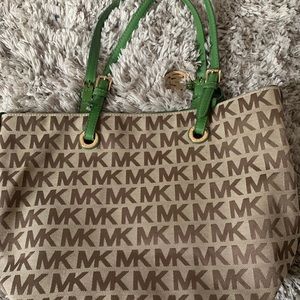 Authentic Michael Kors purse with green straps